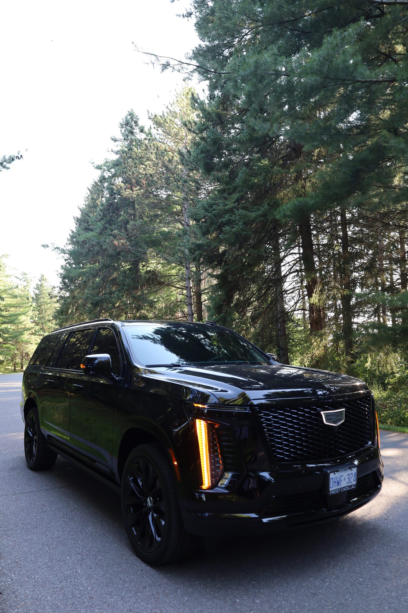 Legacy Limos black Cadillac Escalade — front three-quarter view